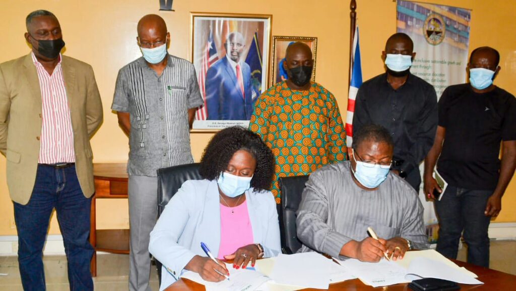 Faith Akovi Cooper and Hon Augustus J. Flomo signed MoU for NGO online accreditation
